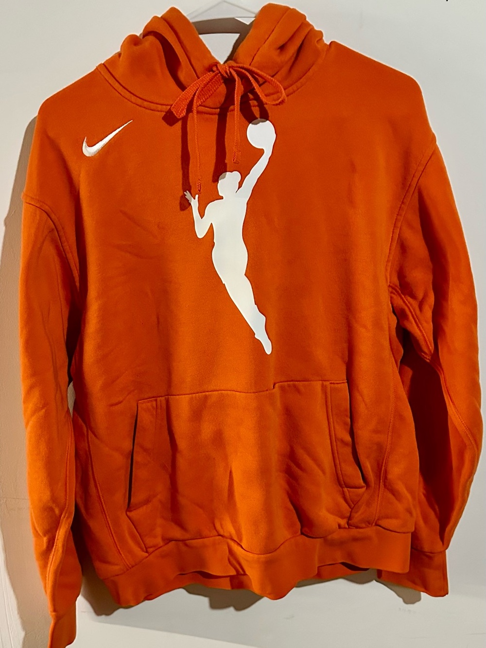 Nike Orange Sweatshirt with a female Basketball Silhouette.